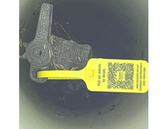 yellow lock out tag on tap